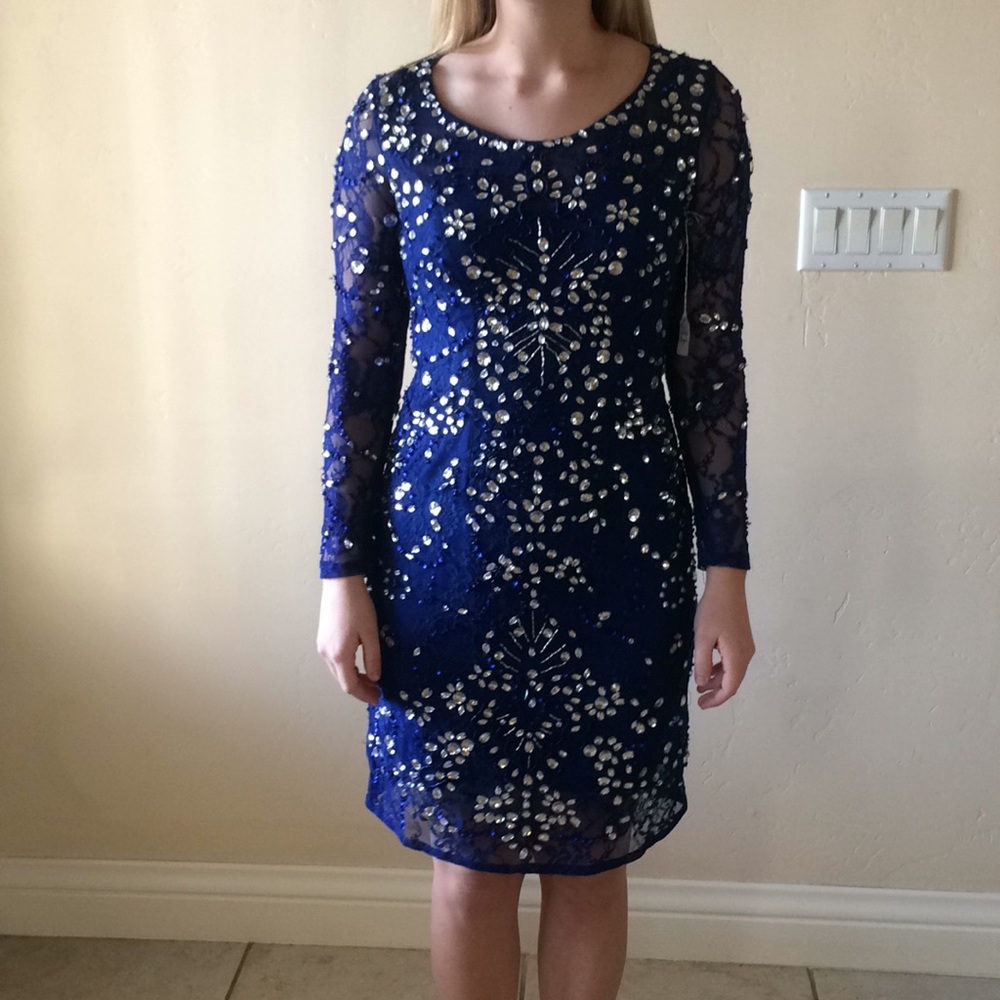 Long sleeve blue knee length dress.